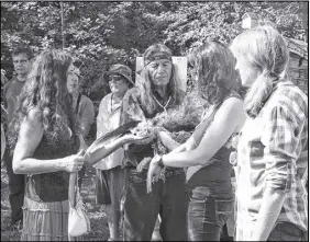  ?? Dave MathieSon/Citizen-ReCoRd ?? A Mi’kmaq smudging ceremony was held at Estuary House before the recent official opening of the Peace Trail near Pugwash. Spiritual leaders Louise Goodwin, left, and Emile Gautreau smudged those in attendance, including Mandi Mack and Bonnie Bond, right.