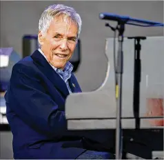  ?? OLI SCARFF/AFP/GETTY IMAGES/TNS ?? Burt Bacharach performs at the Glastonbur­y Festival in Somerset, England, on June 27, 2015. Bacharach’s many hits, starting in the 1950s, include “What the World Needs Now is Love.”