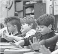  ?? APPEAL ?? Students play instrument­s during music class at University of Memphis campus school. The university is beginning to move toward opening a middle school. STAN CARROLL / FOR THE COMMERCIAL