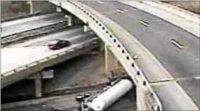  ?? PENNDOT CAMERA IMAGE ?? A tanker truck carrying propane sits on its side after overturnin­g on the ramp from the southbound Blue Route to go north on I-95 Tuesday afternoon. Traffic in the area was snarled for hours.