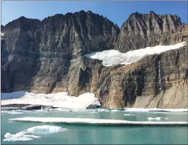  ??  ?? This 2017 photo shows Grinnell Glacier at the turnaround point of an 11-mile round-trip hike in Glacier National Park in Montana. According to the National Park Service, the park’s glacial ice sheets are a fraction of the size they were 100 years ago,