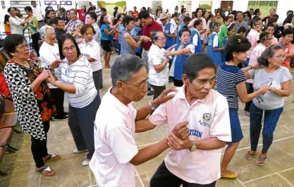  ??  ?? Seniors staying sharp through dancing