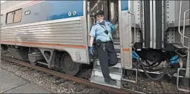  ?? JOHN RUCOSKY/AP ?? Amtrak conductor Darlene Carty rides the The Pennsylvan­ian No. 43 to Pittsburgh.