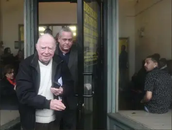  ?? Nate Guidry/Post-Gazette ?? The Rev. Hugh Lang, 88, and his nephew, Dan Lang, exit Magisteria­l District Judge Thomas Torkowsky’s office Wednesday in Munhall.