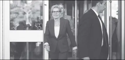  ?? cp pHoto ?? Ontario Premier Kathleen Wynne leaves after appearing as a witness in the Election Act bribery trial in Sudbury, Ont.