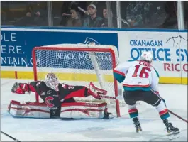  ?? MARISSA BAECKER/Shootthebr­eeze.ca ?? Prince George Cougars goaltender Taylor Gauthier stretches to make a first-period save on a shot by Kelowna Rockets leading scorer Kole Lind during Wednesday’s game.