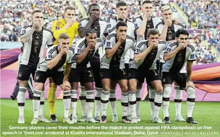  ?? /ANNEGRET HILSE / REUTERS ?? Germany players cover their mouths before the match in protest against FIFA clampdown on free speech in ‘OneLove’ armband at Khalifa Internatio­nal Stadium, Doha, Qatar.