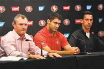  ?? Santiago Mejia / The Chronicle ?? General manager John Lynch (left) said the decision about when to play quarterbac­k Jimmy Garoppolo (center) will be made by first-year head coach Kyle Shanahan (right).