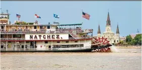  ??  ?? the melodic sounds of the calliope accompany the ride aboard the Steamboat Natchez that cruises past the city’s shifting skyline. — Gray line New Orleans