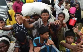  ?? MUNIR UZ ZAMAN/AFP/GETTY IMAGES ?? Relief efforts for Rohingya Muslims fleeing ethnic persecutio­n in Burma have been rapidly overwhelme­d.