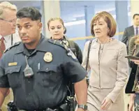  ?? [AP PHOTO] ?? Sen. Susan Collins, R-Maine, is followed by members of the media as she walks to the Capitol before a vote to advance Brett Kavanaugh’s nomination to the Supreme Court on Capitol Hill on Friday in Washington.