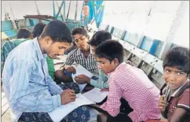  ?? UTPAL PARASHAR/HT PHOTO ?? Students take classes on a boat in a ‘floating school’ in Assam.