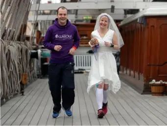  ?? (PA) ?? Breast cancer survivor Jackie Scully ran with her new husband Duncan Sloan on the The Cutty Sark