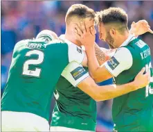  ??  ?? S WEET RELIEF: Two-goal hero Anthony Stokes is hailed by Hibs skipper David Gray, left, and James Keatings