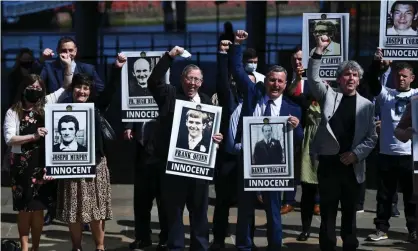  ?? Photograph: Clodagh Kilcoyne/Reuters ?? Relatives celebratin­g on 11 May 2021 after the coroner found the victims of the 1971 attack were innocent. They have demanded Boris Johnson apologise in the Commons.