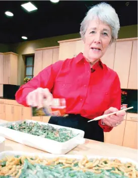  ?? AP FILE PHOTO ?? Dorcas Reilly prepares green bean casserole at the Campbell Soup Co. corporate kitchen in Camden, New Jersey, in this 2005 photo.