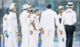  ?? REUTERS ?? ■ Rangana Herath (centre) with teammates after dismissing Hashim Amla (not in pic) on Sunday.