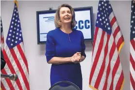  ?? J. SCOTT APPLEWHITE/ASSOCIATED PRESS ?? House Democratic Leader Nancy Pelosi smiles as she meets with reporters on Election Day on Nov. 6 at the Democratic National Committee headquarte­rs in Washington.