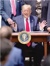  ?? EVAN VUCCI/AP ?? President Donald Trump speaks as he signs the Paycheck Protection Program Flexibilit­y Act on Friday at the White House.
