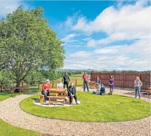  ?? Picture: Steve Brown. ?? The Robert Smith Court group in their new garden.