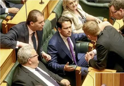  ?? PHOTOS: KEVIN STENT/STUFF ?? National’s Simon Bridges plays hardball over Trevor Mallard’s nomination for Speaker of the House at the opening of Parliament yesterday. New Speaker of the House Trevor Mallard, below, accepts the chair yesterday.