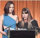  ??  ?? “Woman Woman” star Gal Gadot, left, and director Patty Jenkins receive the Spotlight Award for bringing in huge box office and reviews success.