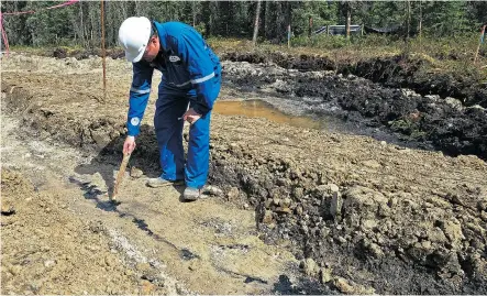  ?? Postmedia News/Files ?? Ryan Cameron, in charge of the cleanup in 2013, points to the bitumen emulsion seeping up through this fissure at the Canadian Natural Resources Limited (CNRL) Primrose oilsand project sites north of Cold Lake. A total of four sites had this seepage...