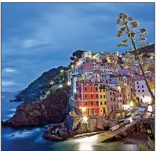  ?? Rick Steves’ Europe/DOMINIC ARIZONA BONUCCELLI ?? The picture-perfect setting of the Cinque Terre villages (in this case, Riomaggior­e) draws millions of tourists annually.