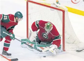  ??  ?? goalie Devan Dubnyk makes a save in the third period.