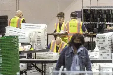  ??  ?? election workers count ballots at the Philadelph­ia Convention Center in Philadelph­ia, Pennsylvan­ia. — AFP photo