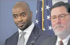  ?? Matt Freed/Post-Gazette ?? NFL Hall of Famer Curtis Martin, left, and Mayor Bill Peduto attend the announceme­nt Tuesday of a multi-sport field to be built in Homewood. The news conference was held at the City-County Building in Downtown.