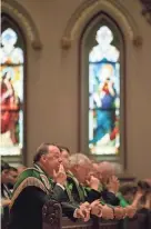  ?? RICHARD BURKHART/SAVANNAH MORNING NEWS ?? Grand Marshal John Forbes prays during the St. Patrick's Day Mass on Saturday.