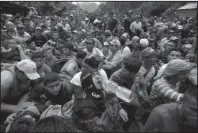  ?? The Associated Press ?? BLOCKED AT THE BORDER: Hundreds of Hondurans are blocked at the border crossing Monday in Agua Caliente, Guatemala. A caravan of Honduran migrant moved towards the country’s border with Guatemala in a desperate attempt to flee poverty and seek new lives in the United States.