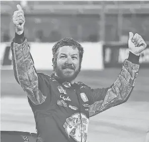  ?? JAMES GILBERT/ GETTY IMAGES ?? With a second win, Martin Truex Jr. is second in the Cup standings, 76 points behind Denny Hamlin and one ahead of Joey Logano.