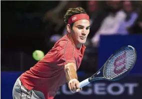  ??  ?? Powerful shot: Roger Federer in action against Peter Gojowczyk during the Basel Open first-round match on Monday. — AFP