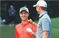  ?? SAM GREENWOOD / GETTY IMAGES / AFP ?? Justin Thomas (left) is congratula­ted by Jordan Spieth after chipping in for eagle on the 10th hole during the first round of the Sony Open at Waialae Country Club on Thursday in Honolulu, Hawaii.