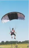  ?? Photo provided by Chuck Akers. ?? Nick Batsch prepares to land at the 2018 World Canopy Piloting Championsh­ips in Poland.