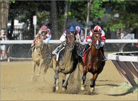  ?? ARIANNA SPADONI — NYRA ?? Songbird, right, and Carina Mia enter the stretch during Sunday’s Coaching Club American Oaks at Saratoga Race Course in Saratoga Springs.