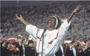  ?? GEORGE ROSE/ GETTY IMAGES ?? Whitney Houston sings the national anthem before the Super Bowl in Tampa, Florida, on Jan. 27, 1991.