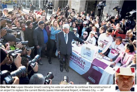  ?? — AP ?? One for me: Lopez Obrador (inset) casting his vote on whether to continue the constructi­on of an airport to replace the current Benito Juarez Internatio­nal Airport, in Mexico City.