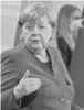  ?? JOHN MACDOUGALL/POOL VIA AP ?? After Germany passed a grim milestone for COVID-19 deaths, German Chancellor Angela Merkel said the country is still recording over 300 a day.