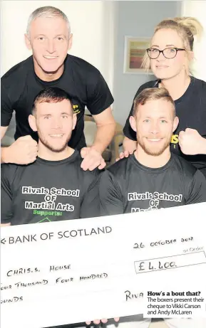  ??  ?? How’s a bout that? The boxers present their cheque to Vikki Carson and Andy Mclaren