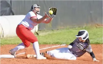  ?? STAFF PHOTO BY MATT HAMILTON ?? Bradley Central’s Ma’ryah Greenwood slides in to third as Ooltewah’s Courtney Hughes can’t make the tag in time on Tuesday.