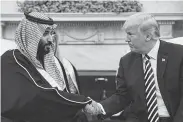  ?? Mandel Ngan / AFP/Getty Images ?? Saudi Arabia’s Crown Prince Mohammed bin Salman meets President Donald Trump in March.