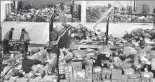  ?? PEI QIANG / FOR CHINA DAILY ?? Workers at a delivery company in Lanzhou, Gansu province, sort parcels.