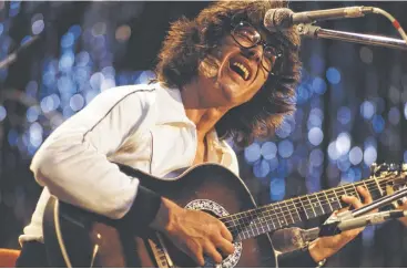  ?? Getty Images file photos ?? Jazz-fusion guitarist Larry Coryell performs at the Montreux Jazz Festival in 1977 in Switzerlan­d.