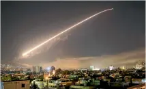  ?? AP ?? Missile fire lights up the night sky during the joint attack targeting several areas of Syria’s capital, Damascus.