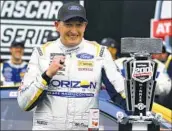  ?? Michael Conroy Associated Press ?? MICHAEL McDOWELL edged Chase Elliott by less than one-tenth of a second to win the Brickyard 200.