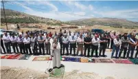  ?? (Mohamad Torokman/Reuters) ?? PALESTINIA­NS ATTEND Friday prayers during a protest against Israel’s plan to annex parts of the West Bank, in Beta village near Nablus.