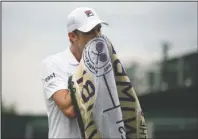  ?? The Associated Press ?? NO SWEAT: United States’ Sam Querrey wipes his face as he plays United States’ Tennys Sandgren Monday in a men’s singles match during the seventh day of the Wimbledon Tennis Championsh­ips in London.